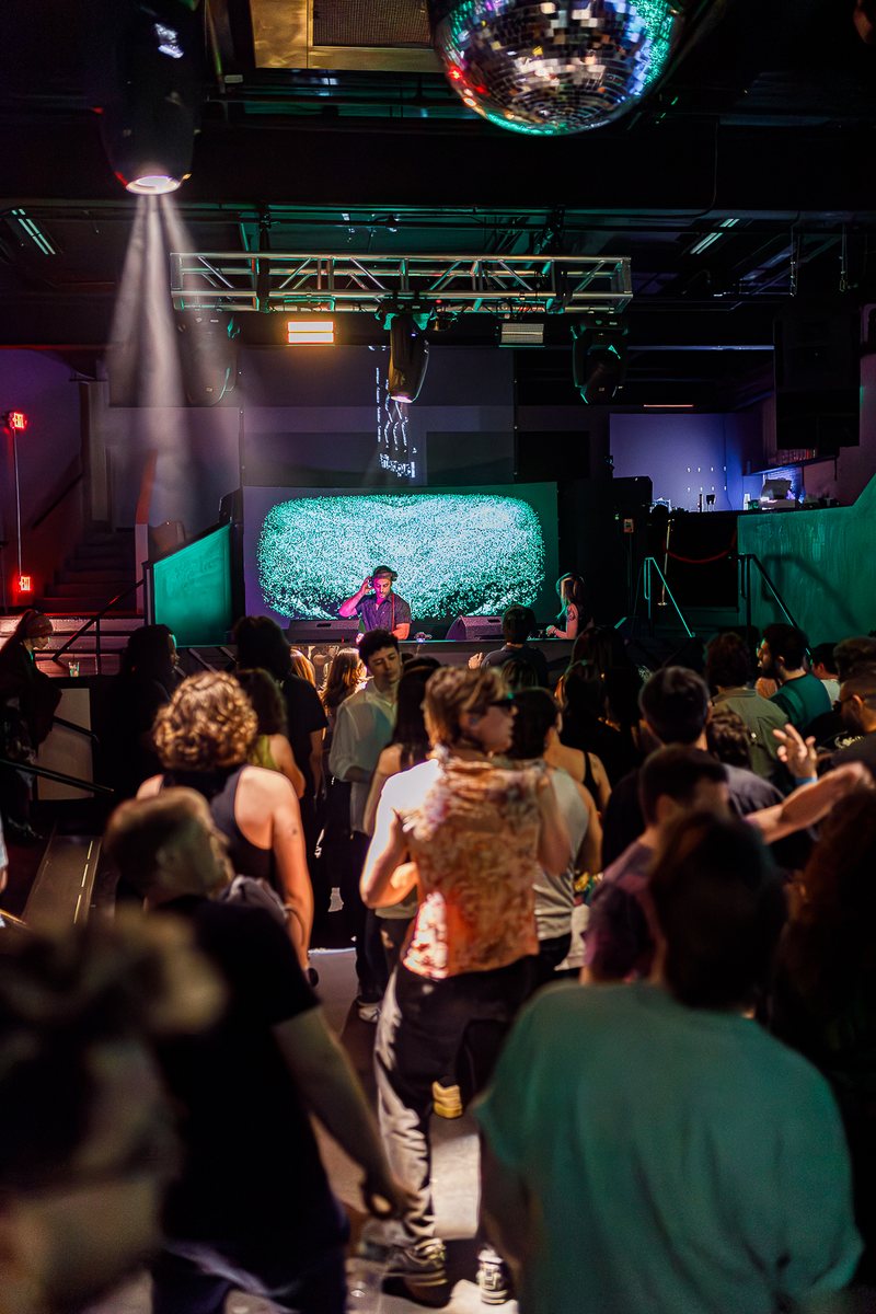 Max Lagardi on stage above a packed floor