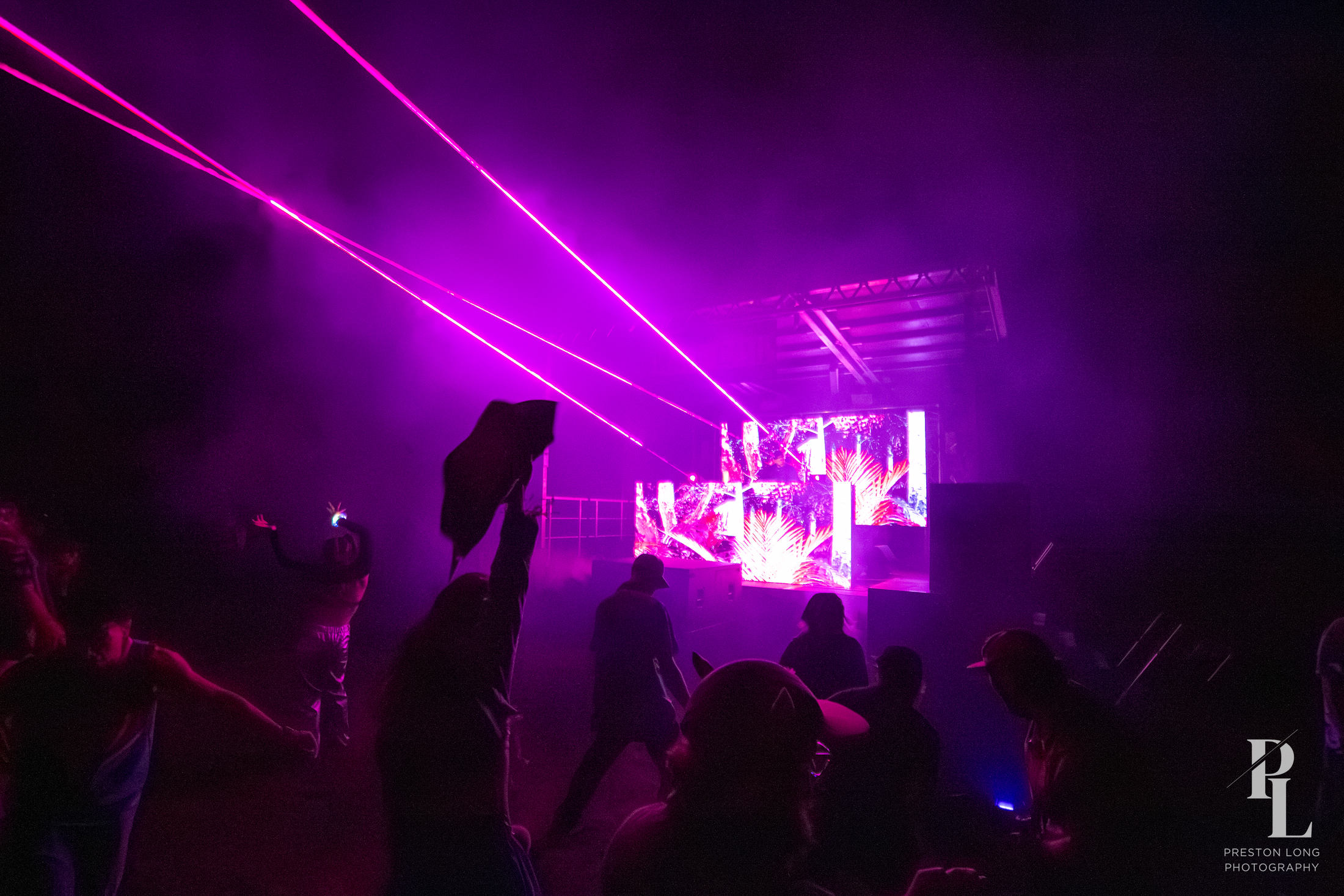pink lasers over the floor at a black label radio show